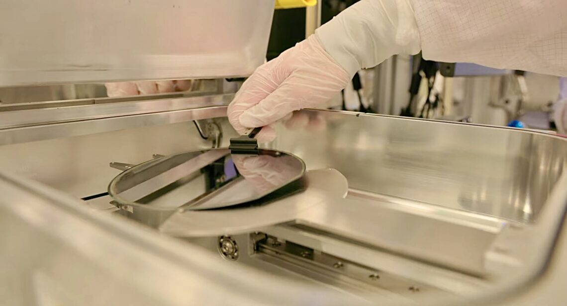 Semiconductor wafer being removed from processing equipment in a cleanroom